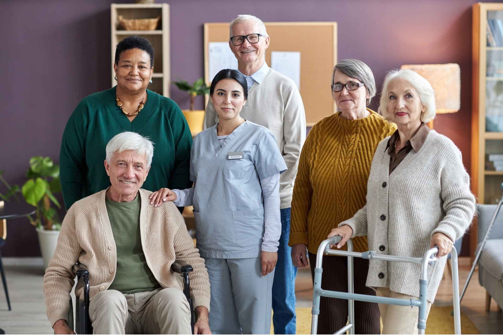 A group of seniors posing together smiling at the camera.